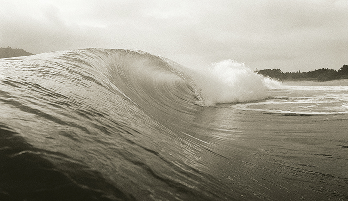 A wave at Matakana Island, New Zealand 1975
I was staying with my friend Rodney Dahlberg and we went out to Matakana in a boat. It really wasn’t that good, but on this not-especially-wonderful day, there was this one, beautiful, just-about-perfect wave.
 Photo: <a href=\"https://www.johnwitzig.com.au/\">John Witzig</a>