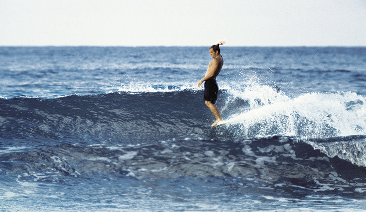 Bob McTavish, Noosa nose ride c. 1966
Just before the start of what would become the shortboard revolution, McTavish with his take on the nose ride – so cool, so stylish, so 1960s.
 Photo: <a href=\"https://www.johnwitzig.com.au/\">John Witzig</a>