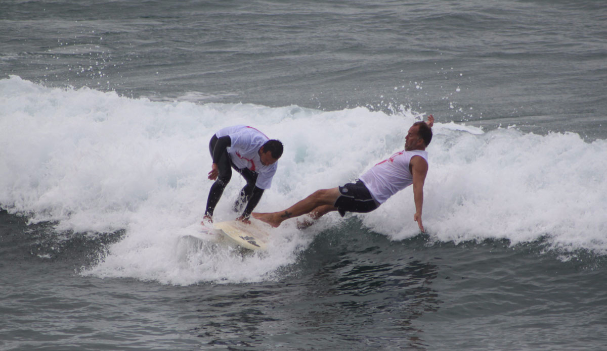 Old guys “Legends Division” were battling it out. Gino Mesinas giving two time national champ and Malibu high surf coach Dale Rhodes a little help off his board. It wouldn’t be County Line without a little hassling, even between friends. Photo: <a href=\"https://instagram.com/jimvandevort/\">Jim Vandevort</a>