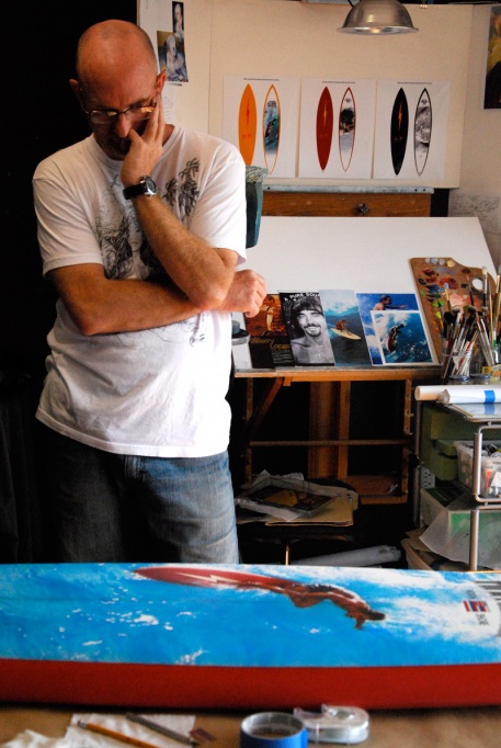 Portrait of the artist: Phil Roberts as he works on the Pipeline Masters commemorative board.