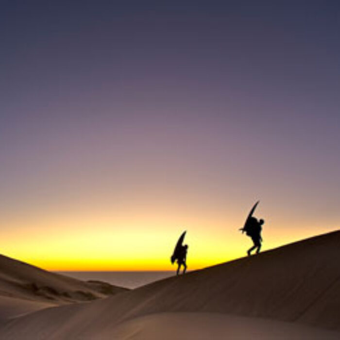 Surfers travel desert