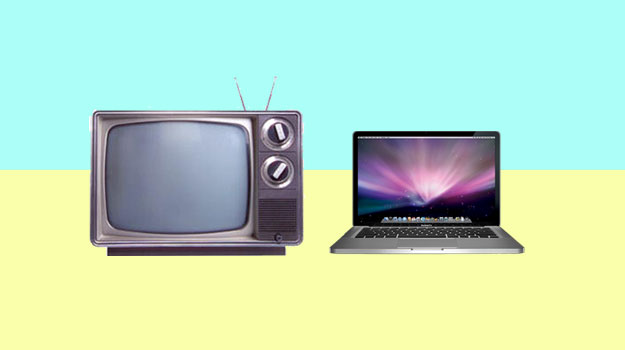 Old TV with antenna and MacBook Pro Laptop Technology
