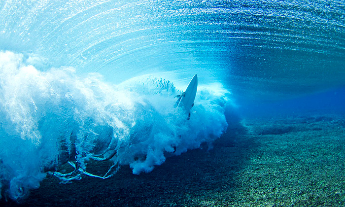 A surfers gets stoked with a mid-surf ion fix. Photo: Gibson