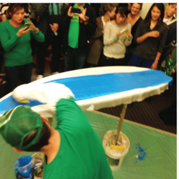 Glassing a surfboard at a Party