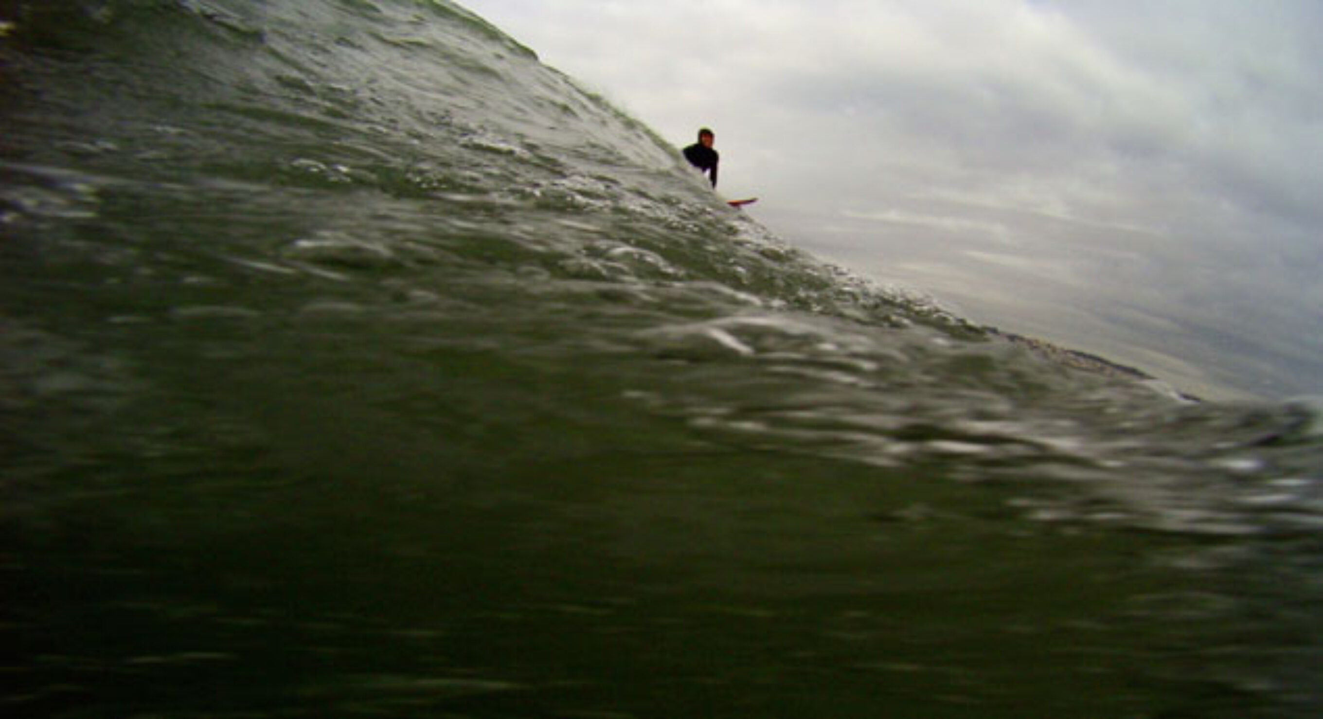 "When the first green wall—tall as a four-story building—marches off the horizon and pushes onto the reef, the base of the wave – the cauldron, as it’s called – drops below sea level, sucking in its gut." Photo: Mark Lukach "When the first green wall—tall as a four-story building—marches off the horizon and pushes onto the reef, the base of the wave – the cauldron, as it’s called – drops below sea level, sucking in its gut." Photo: Mark Lukach