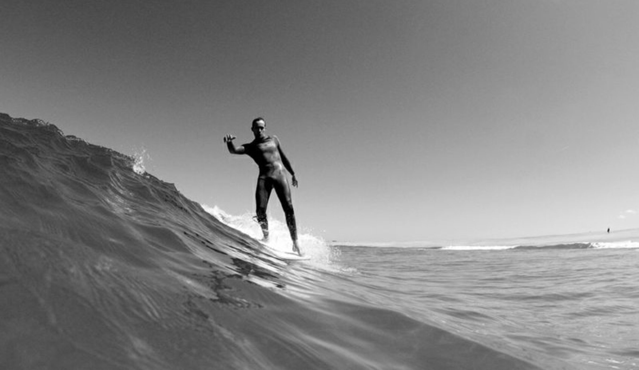 Finally, I popped to my feet and threw my weight into a careening turn that switched all my leftward momentum into a swift right-hand track, ran to the nose of the board and sped across the racing lip of the wave.