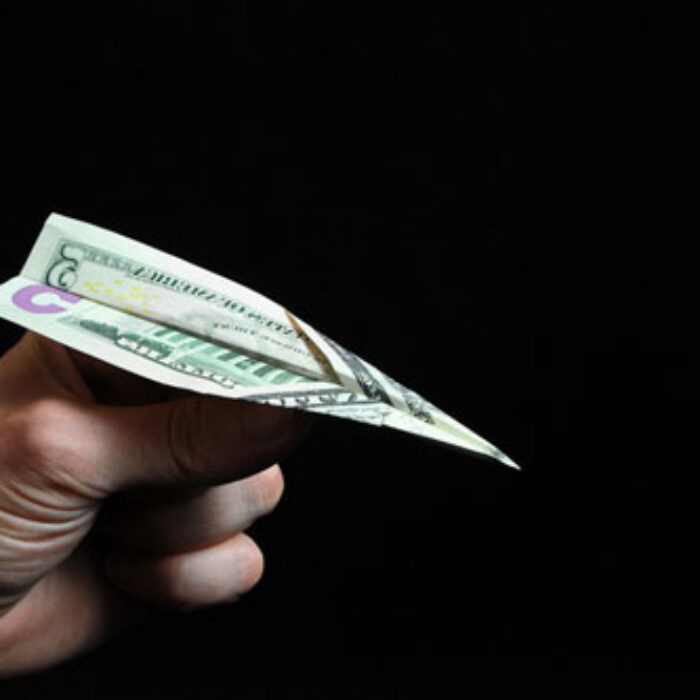 "I couldn’t fathom leaving my board behind. I paid the ridiculous amount with my credit card adding it to my escalating debt." Photo: Shutterstock
