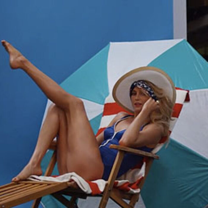 Alana Blanchard is getting to the point where she's known more for her portrayal as a surfer girl than she is for her surfing. This is a day in her life. She plays dress up and drags some things around in a gym. Atta girl!
