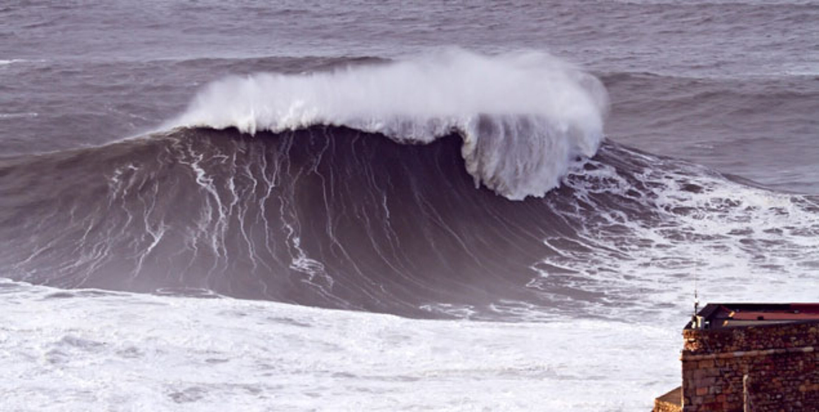 Nazaré and the people who surf there have dealt with its fair share of criticism. Yes, the angle from the cliff makes it look bigger. But when a giant swell hits that tiny little town in Portugal, that the photos that come out of it are spectacular.