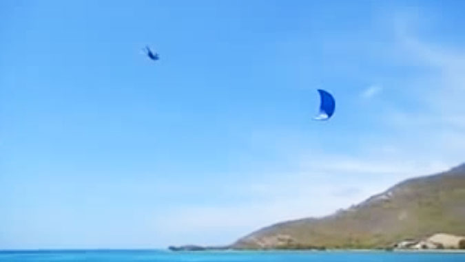 This guy manages to combine kite surfing and cliff diving in one fell swoop. He swooped, then he fell. Oh, does he ever fall.