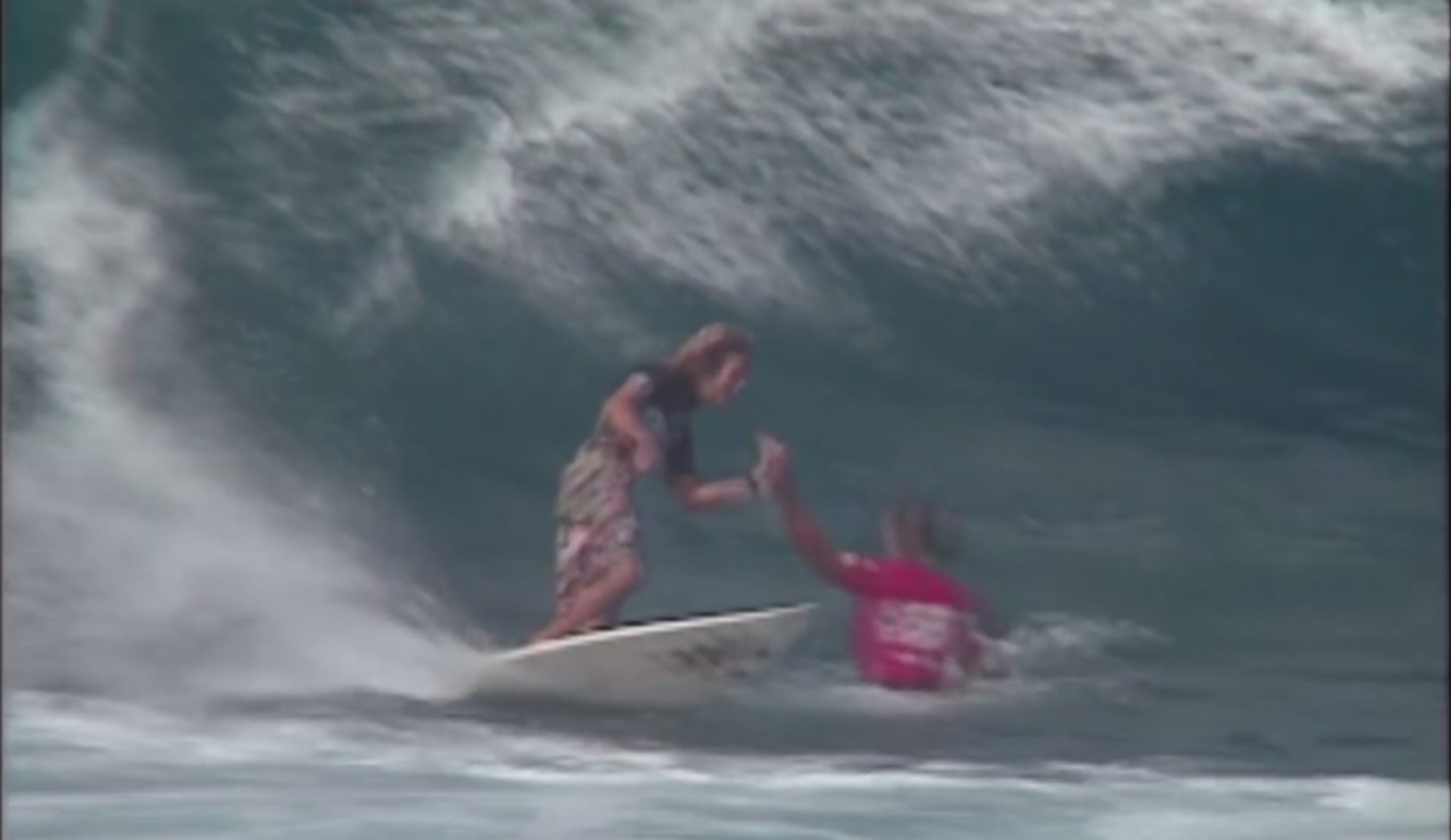 Not even Pipe Masters stood between these two legendary surfers sharing the stoke. Photo: Quiksilver