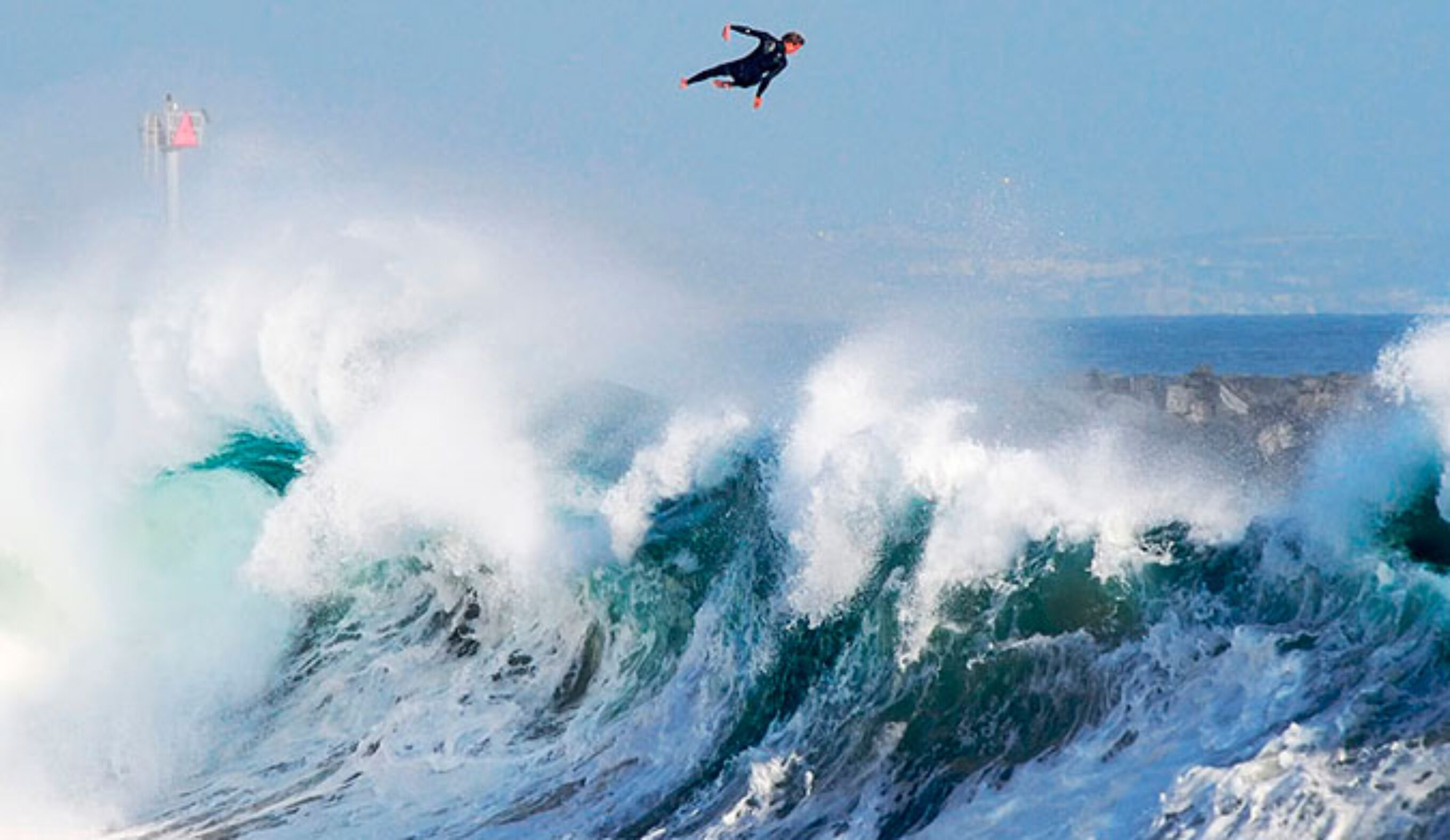 Bobby Okvist airing it out over a triple-overhead wave at The Wedge.