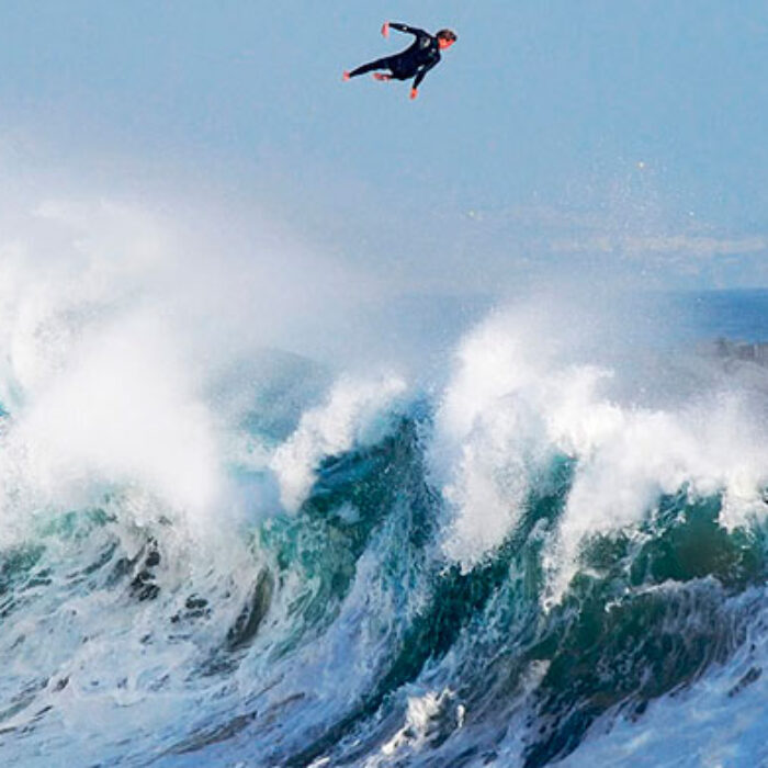 Bobby Okvist airing it out over a triple-overhead wave at The Wedge.