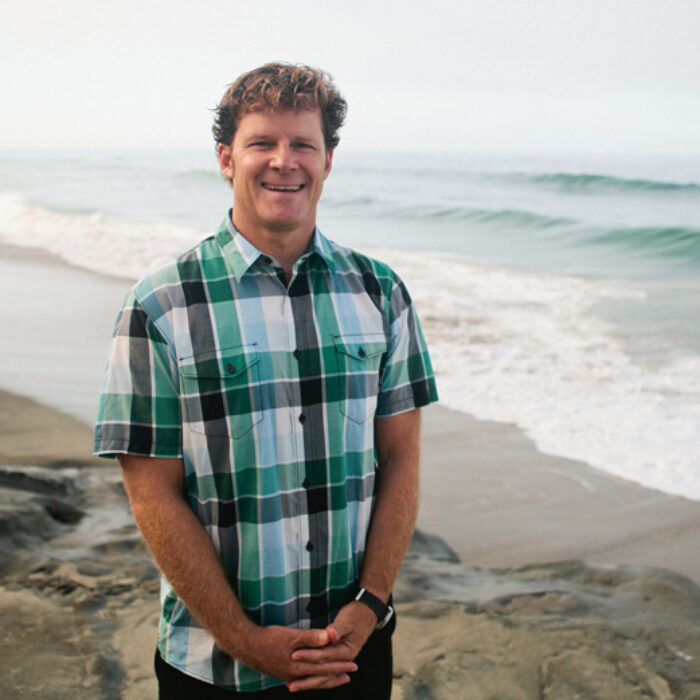 Chad Nelsen in front of the ocean