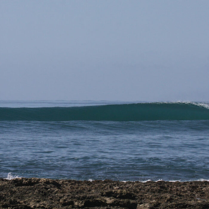 Surf trips can really only be ruined by two things: bad waves or a bad time. Aura Surf Resort has got you covered on both fronts.
