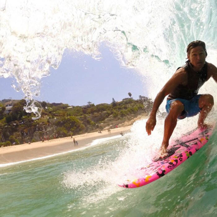 Kalani Robb on a glassy SoCal Barrel.