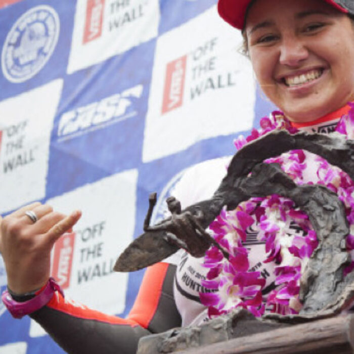 Carissa Moore collects her prize at the U.S Open of Surfing.
