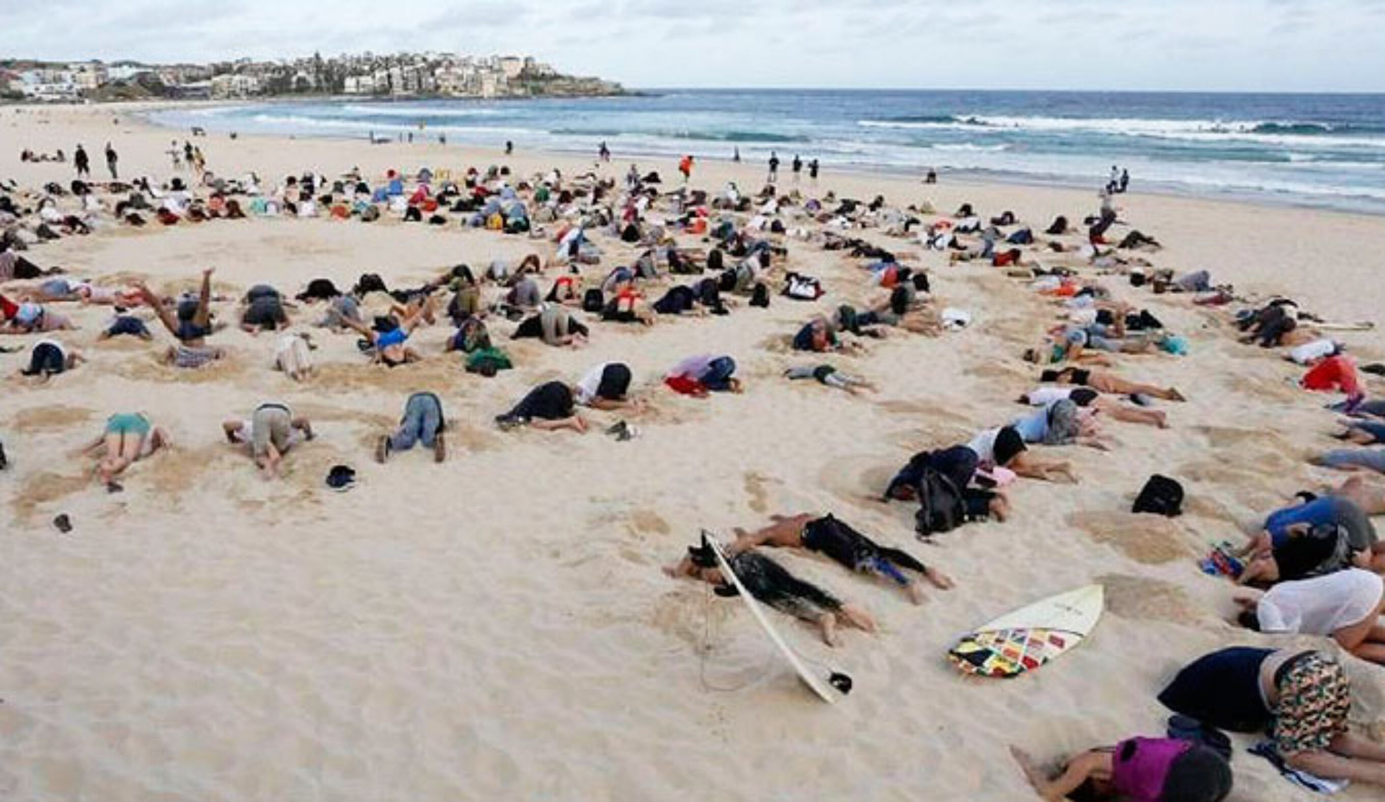 Many believe that Tony Abbott has his head in the sand when it comes to climate change. Photo: Mic.com