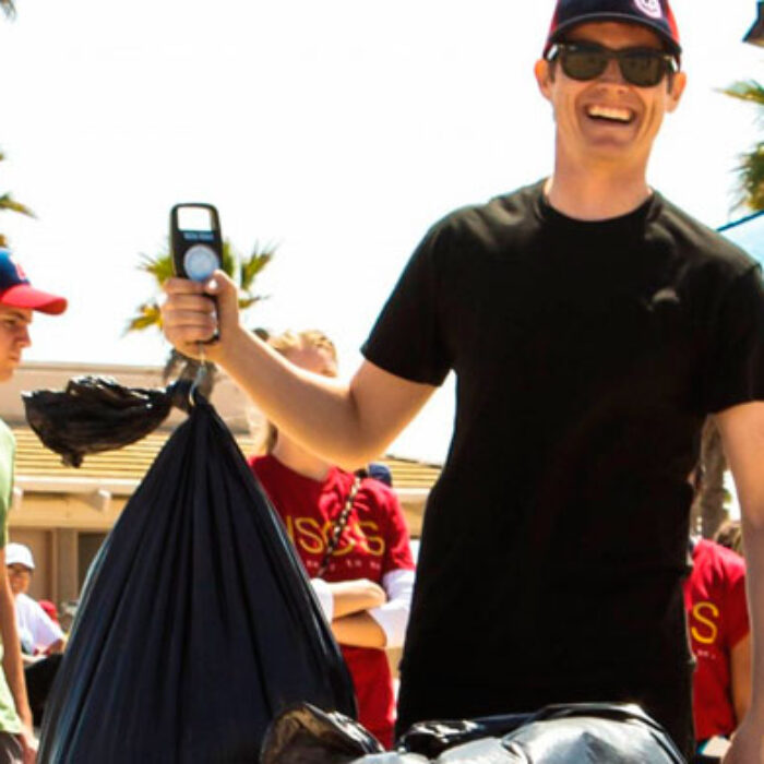Andrew Sneddon weighing in at the end of a long day of cleaning up the beach.