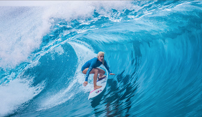 Tatiana perfecting her barrel riding technique in Tahiti.