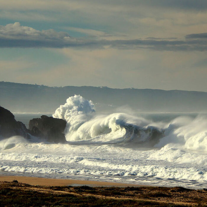 It was out-of-this-world beautiful – the sun was just peeking over the edge the ocean, the colors of the sky were astonishing, and the waves were truly huge.