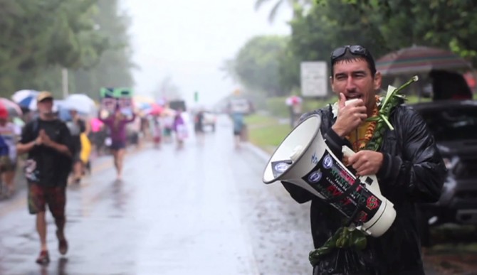 Leading an anti-GMO demonstration on the North Shore of Hawaii. Dustin Barca’s is not only fighting for Kauai, but all of the islands. Photo: Courtesy of Change for Balance Productions