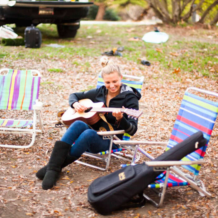 Lakey Peterson playing guitar.