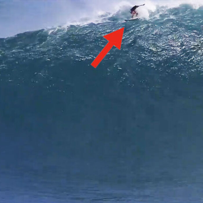 Even while he's jammed in a giant lip with a Peahi wind is howling under his board, he's fully committed to making that wave.