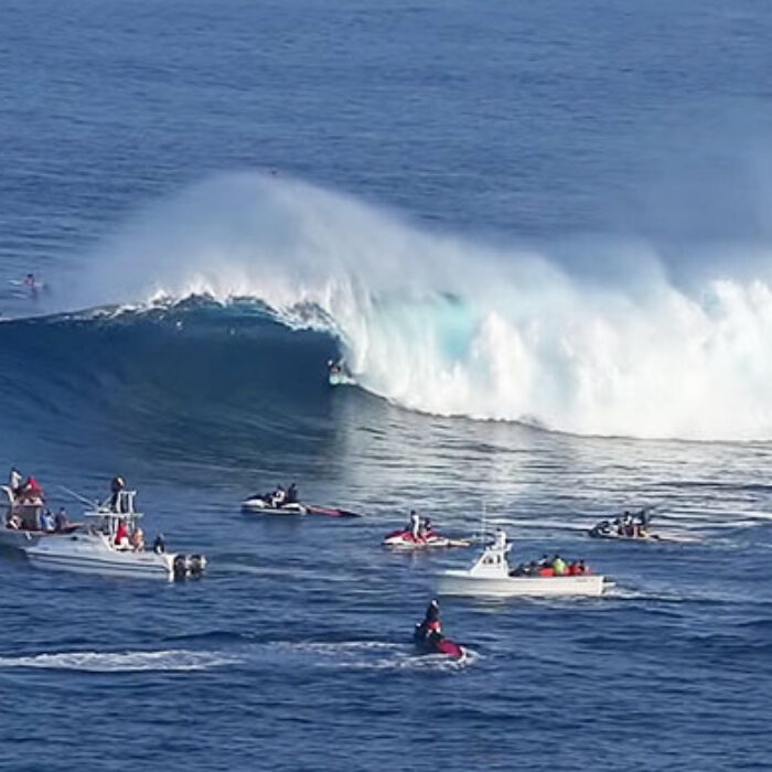 Watch the regular footer pull into a clean tube amidst a packed lineup, slot herself perfectly into classic Jaws barrel, and emerge unscathed in classic Alms fashion.