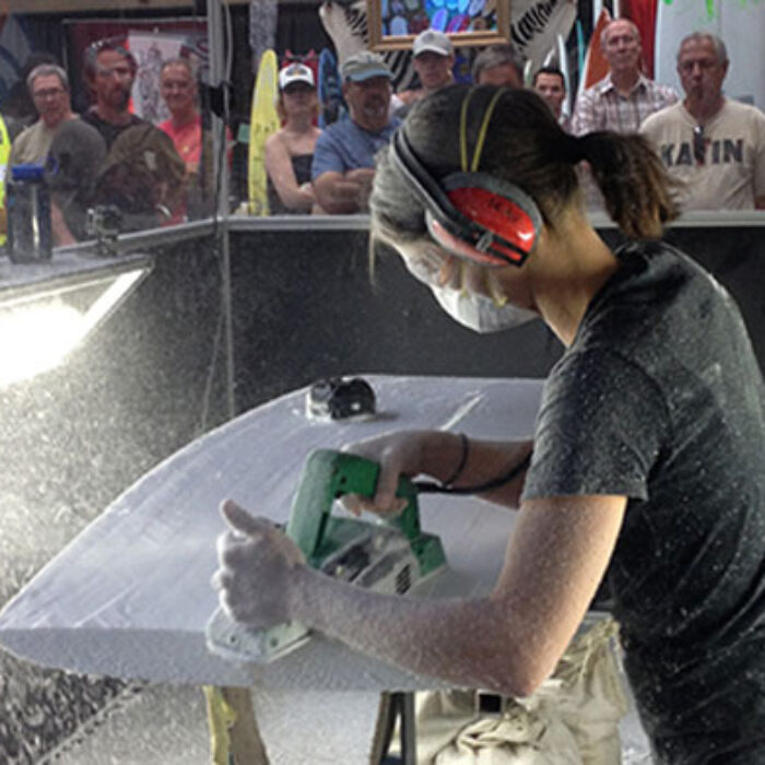 Craftswoman Kelly Connolly mowing foam at The Boardroom.