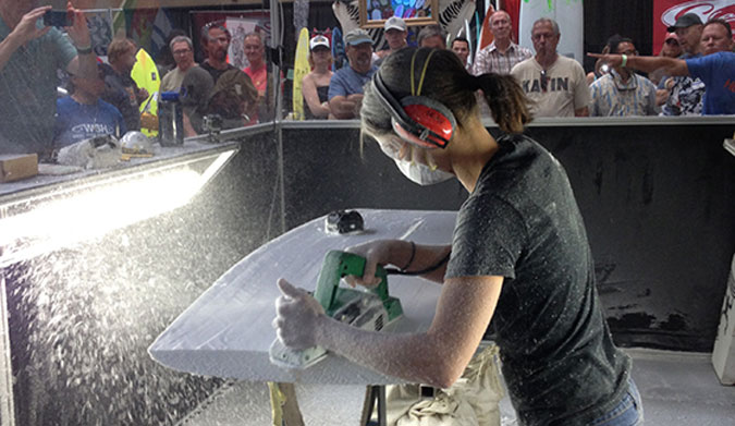 Craftswoman Kelly Connolly mowing foam at The Boardroom.