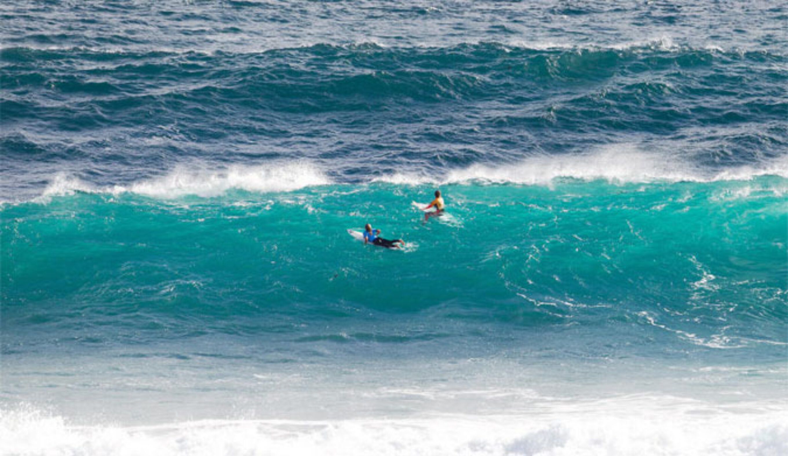 Hawaiians Coco Ho and Carissa Moore waiting out the back for a good wave. Photo: WSL
