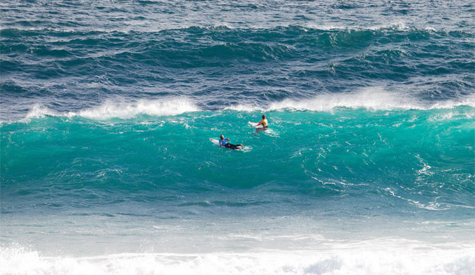 Hawaiians Coco Ho and Carissa Moore waiting out the back for a good wave. Photo: WSL