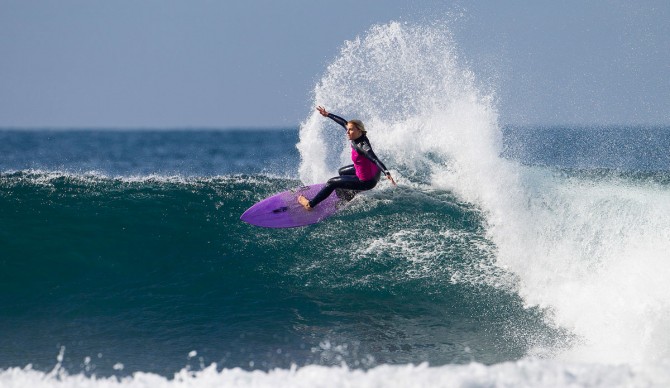 Dimity Stoyle with a large, stickerless section on the nose of her board. As one of the best female surfers in the world, how can that be?