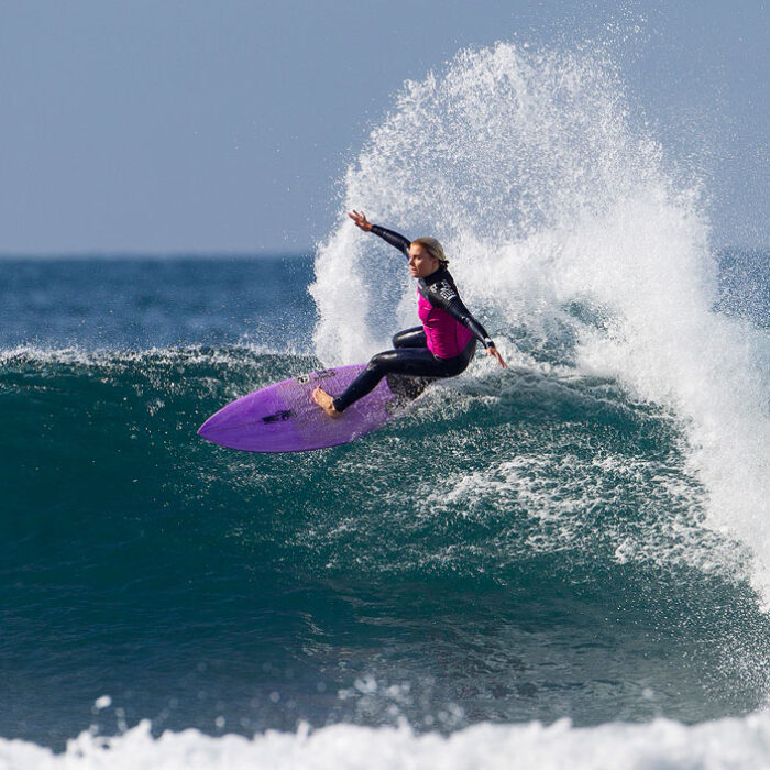 Dimity Stoyle with a large, stickerless section on the nose of her board. As one of the best female surfers in the world, how can that be?