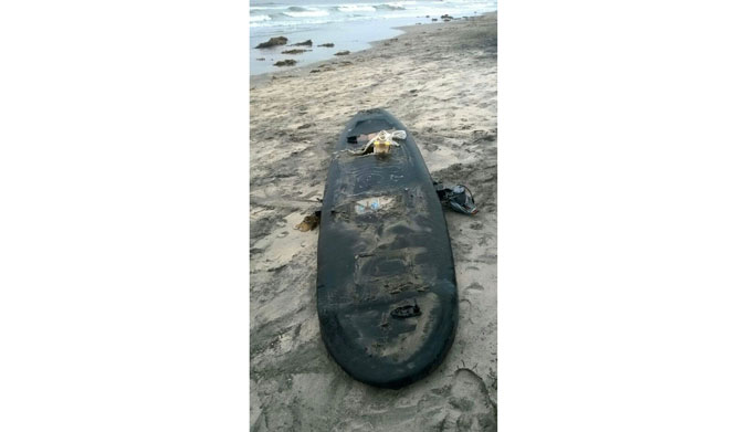 Here's the board when it washed up. What treasure lie within?