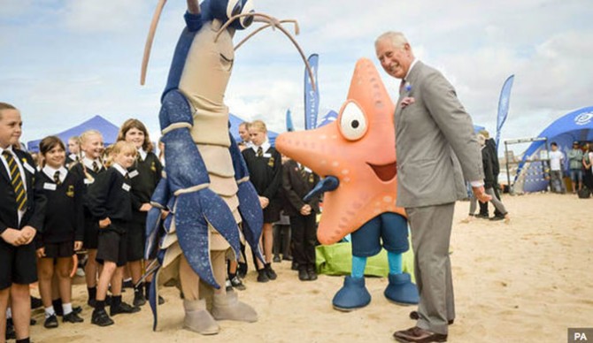 Prince Charles meets Larry the Lobster on Ocean Plastics Awareness Day. Photo: Express 