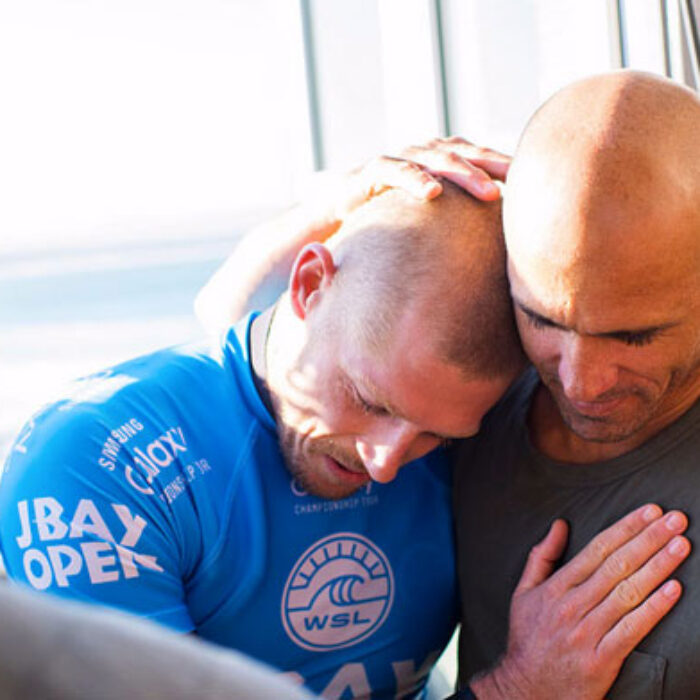 Shark attack! Kelly Slater! Mick Fanning! Hugging! Television gold!