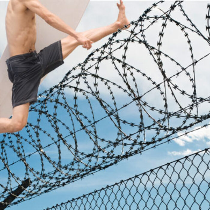 If you are going to escape for a luxurious island prison, the coolest way you can possibly do it with on a surfboard with a little plastic shovel.
