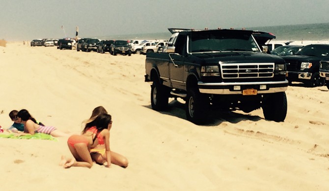 SUV's and beach goers share the same stretch of beach in East Hampton. Who has the right of way?