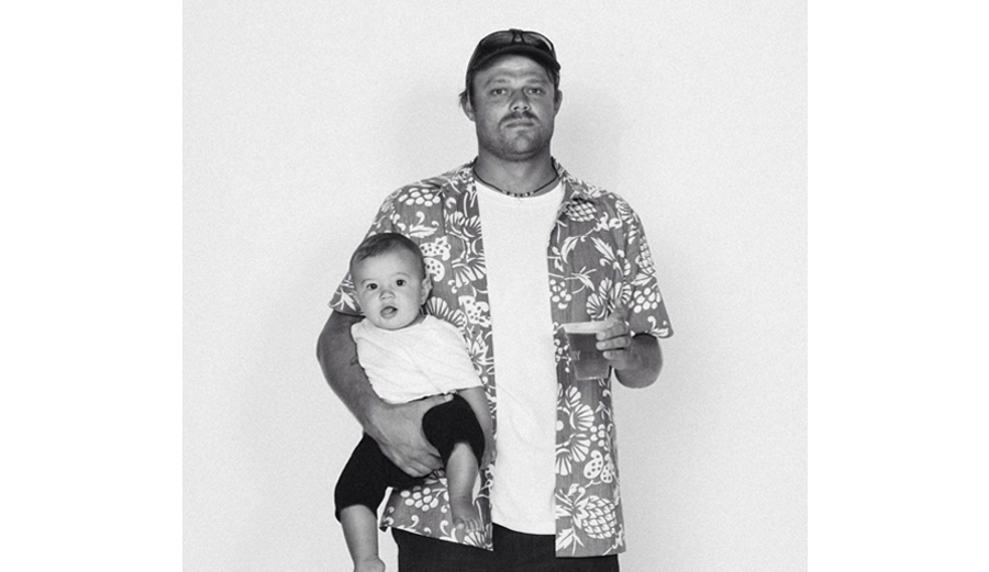 First comes the baby, then comes the dad style. Dane Reynolds and son Sammy. Photo: Surfer / Grant Ellis