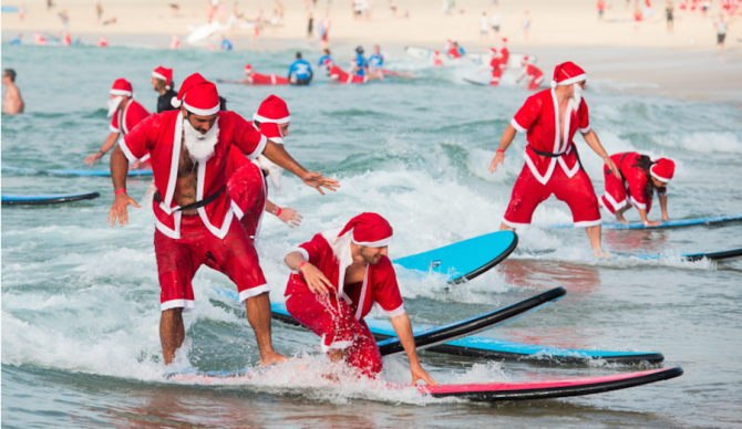 320 surfers flocked to Bondi Beach in Australia last week all clad in Santa Claus suits. The turnout was enough to beat the previous record for largest surf lesson, which was 250. Photo: Redballoon
