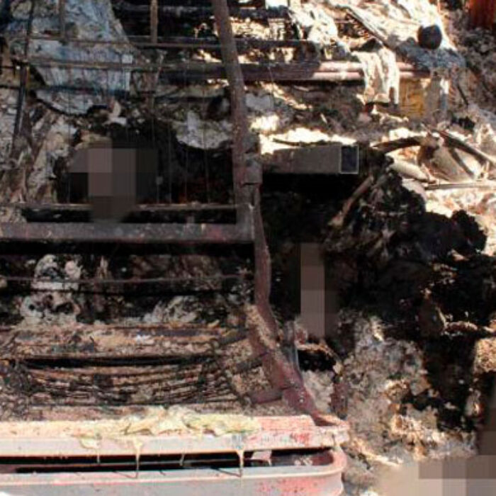 The torched remains of the van and the bodies inside.