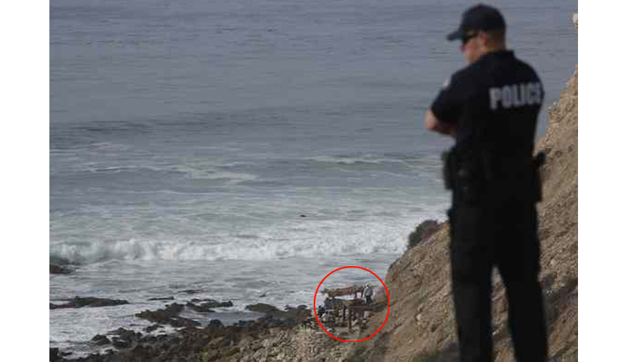 Police investigating the secret hideout of the Lunada Bay Boys last week. Photo: Chuck Bennett/Daily Breeze