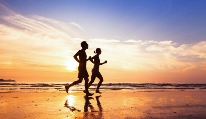 Instead of hitting the gym, grab a friend and head to the beach. Photo: Shutterstock.