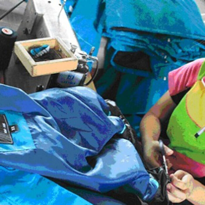Workers cutting fabric for Rip Curl jackets in a factory about 100 kilometres south of Pyongyang in North Korea.