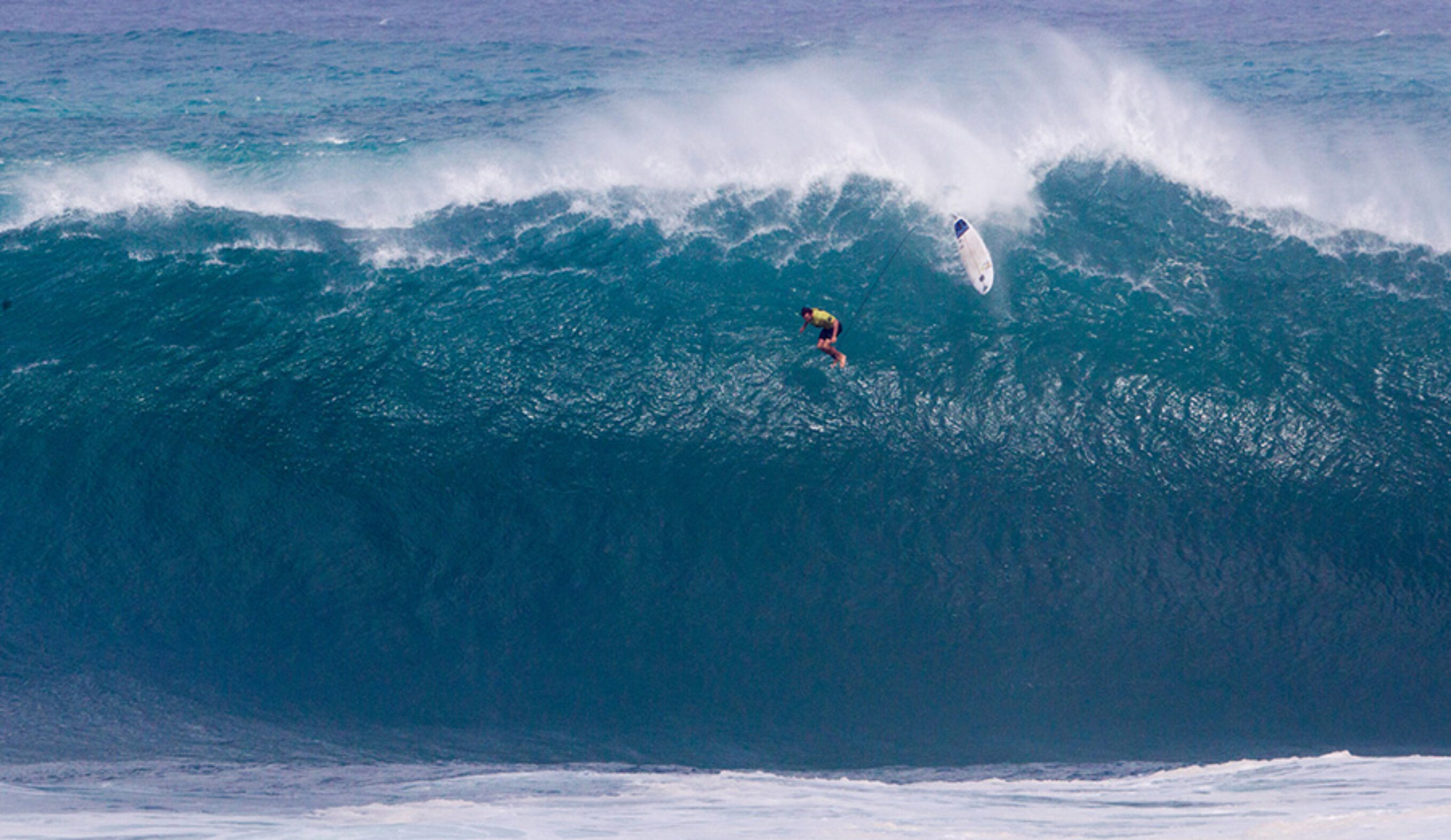 Grant Twiggy Baker of South Africa suffers a massive wipeout, air dropping down a 45ft face during Round 1 of the Quiksilver in Memory of Eddie Aikau on Thursday February 25, 2016. Photo: © WSL/ Heff