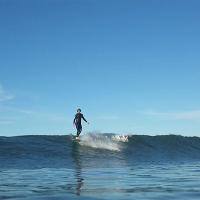 Reilly Stone rides a longboard.