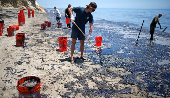 Volunteers help to clean up the devastation at Refugio State Beach in Santa Barbara. Photo: Lucy Nicholson