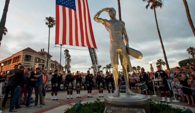 The statue commemorating Ben Carlson was unveiled Wednesday at the Newport Beach pier. Photo: Leonard Ortiz/ OC Register